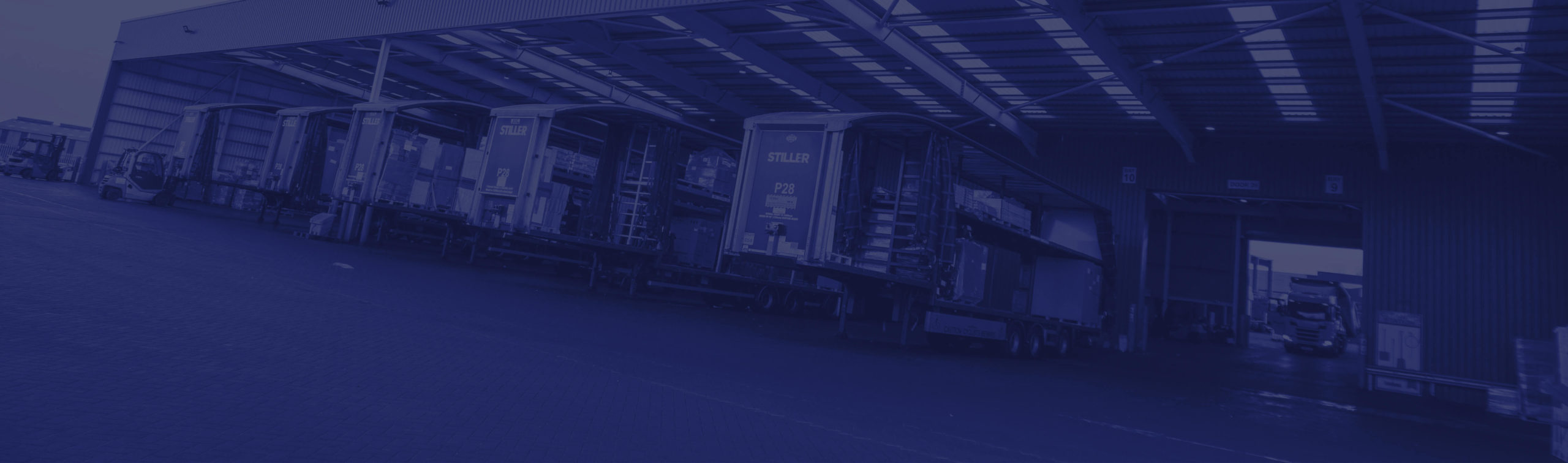 Stiller warehouse interior with parked vehicles